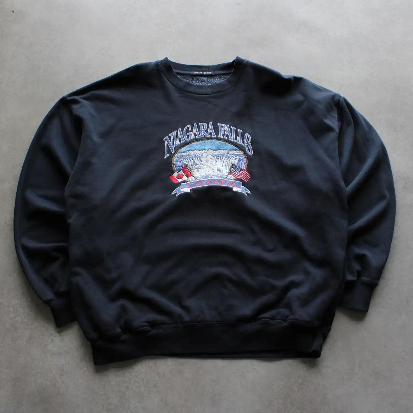 Brandy Melville “Niagara Falls Canada” Sweatshirt – Black (Man-XL)